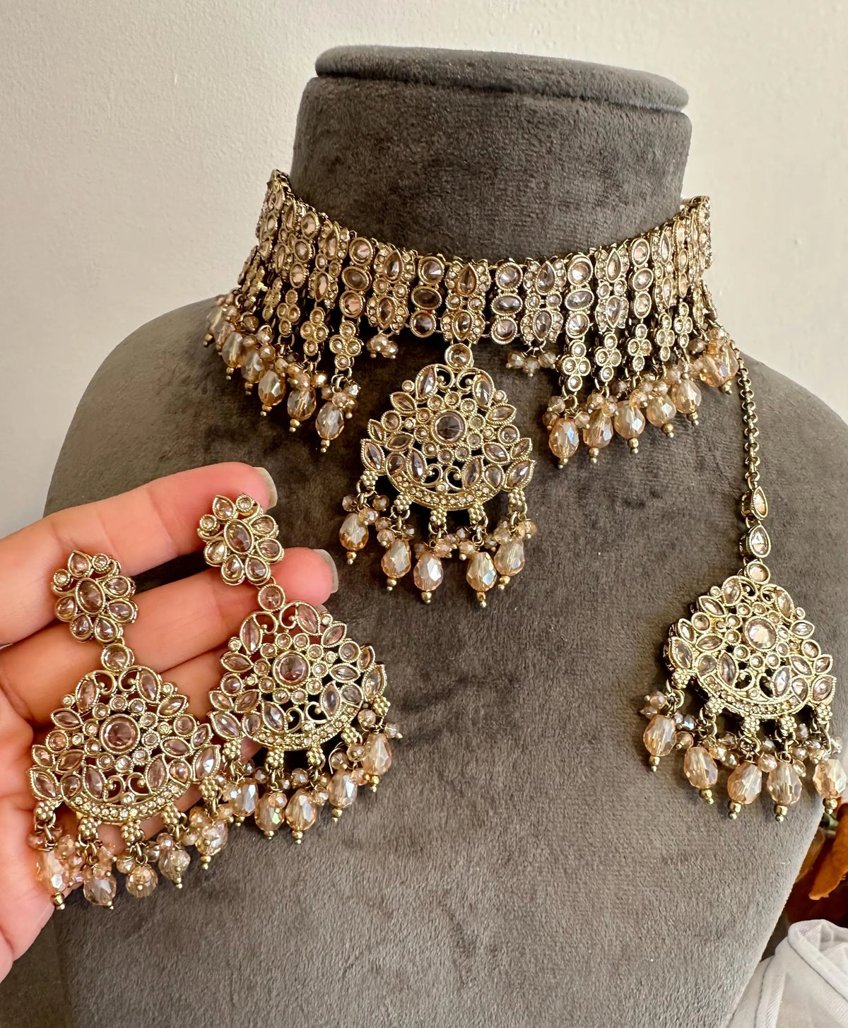 Gold polki choker necklace and earrings set with coloured stones, made in India